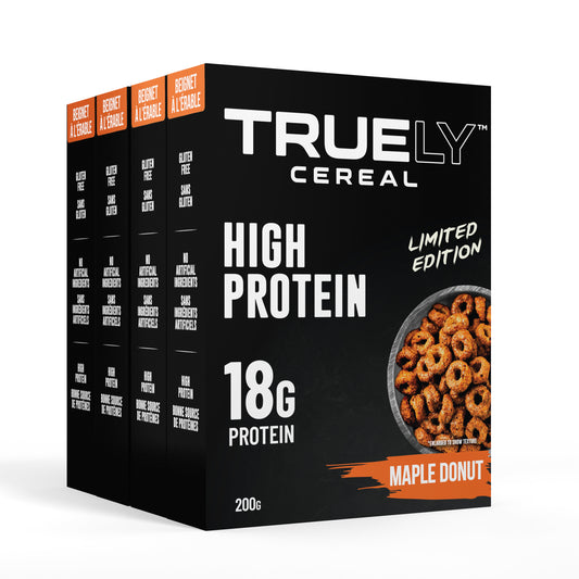 Boxes of Truely High Protein Maple Donut flavored cereal. The packaging is predominantly black with images of the cereal and '18g Protein' highlighted in white text.