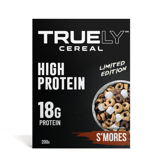 Packaging of Truely Protein Cereal S'Mores showing the brand name, product name, and a bowl of cereal with marshmallows. The packaging states it is a high protein product with 18g protein per serving and indicates it is a limited edition.