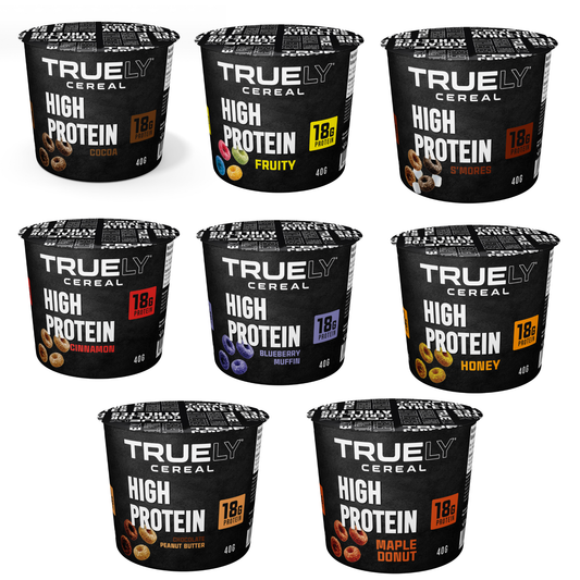 A variety of Truely Protein Cereal single serving cups in different flavors. The packaging is black with the brand name and flavor details visible.